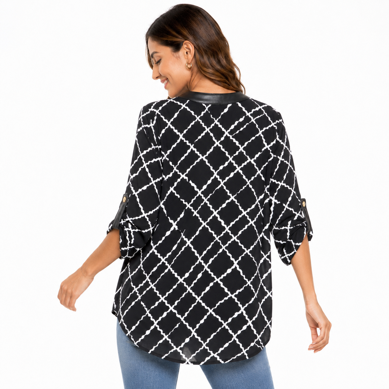 Anne Klein blouse has a geometric design in black and white