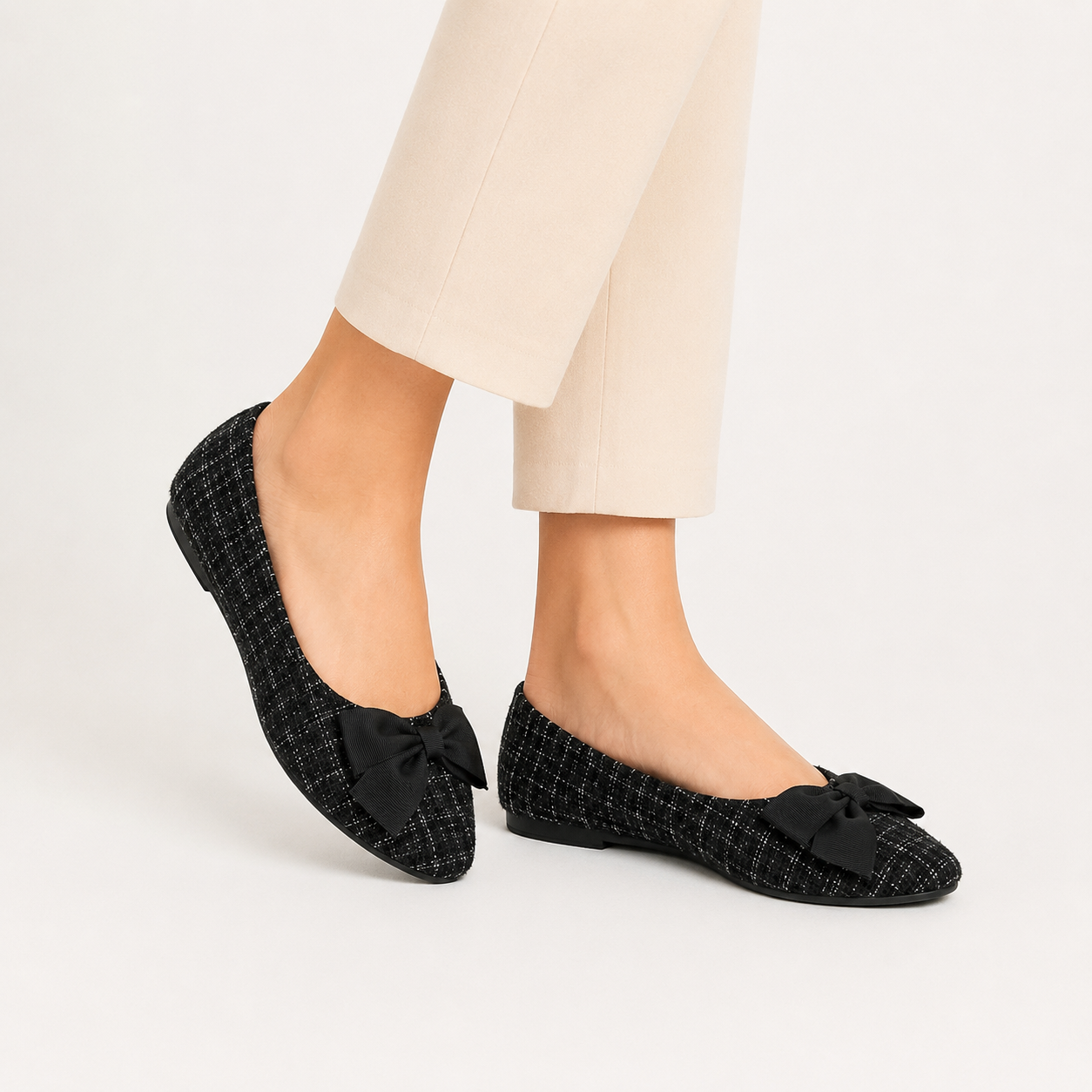Kenneth Cole Reaction Lily Bow ballerinas in tweed fabric with sharp toe and black bow.