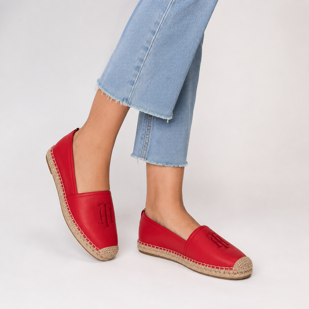 Tommy Hilfiger red espadrilles with the embroidered "TH" logo and a jute sole.