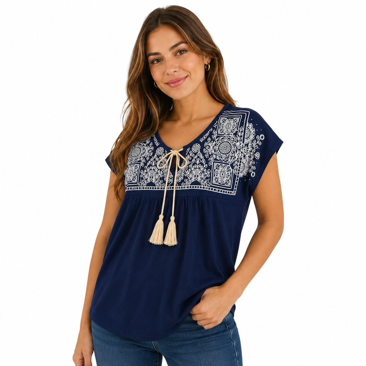 Agaci blouse is navy blue with white embroidery on the collar