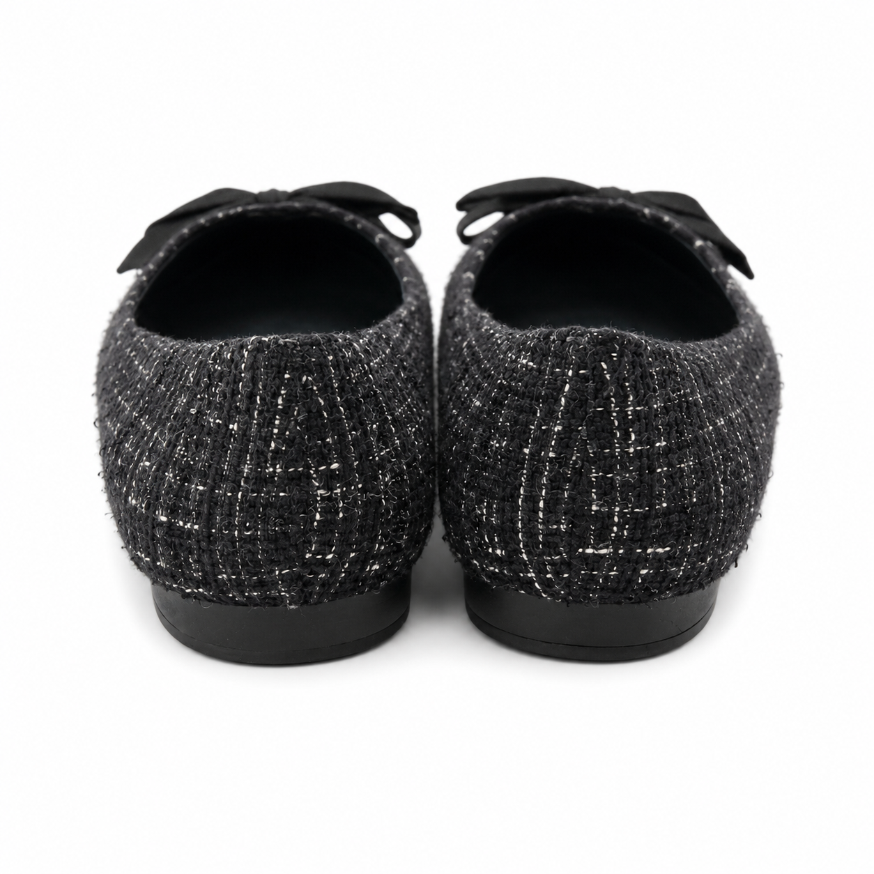 Kenneth Cole Reaction Lily Bow ballerinas in tweed fabric with sharp toe and black bow.