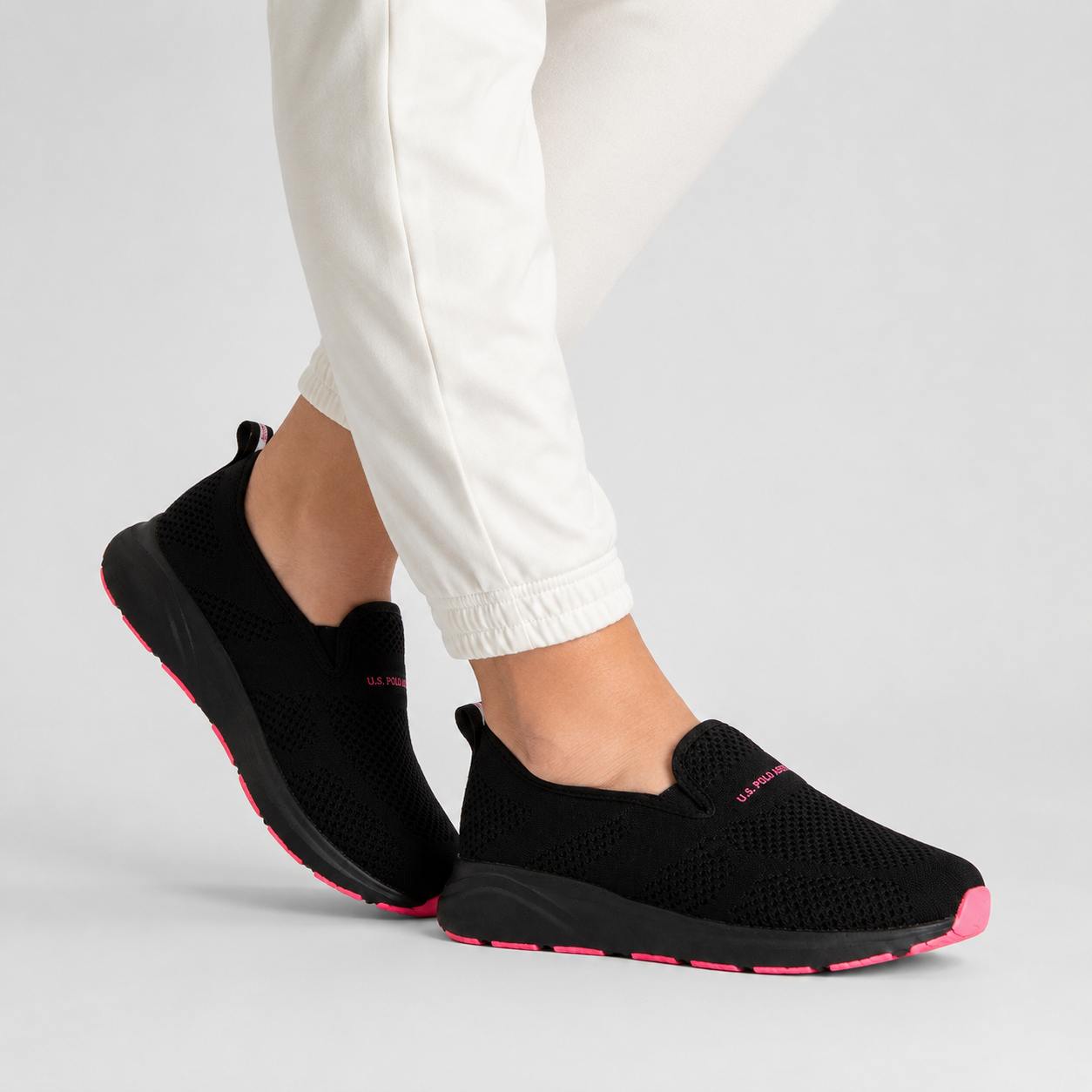 Us Polo Assn Women's sneakers from the brand in black with pink details.