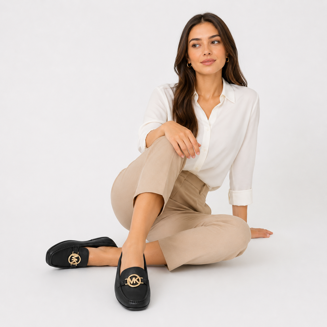Michael Kors Fulton loafers in black with a characteristic golden logo
