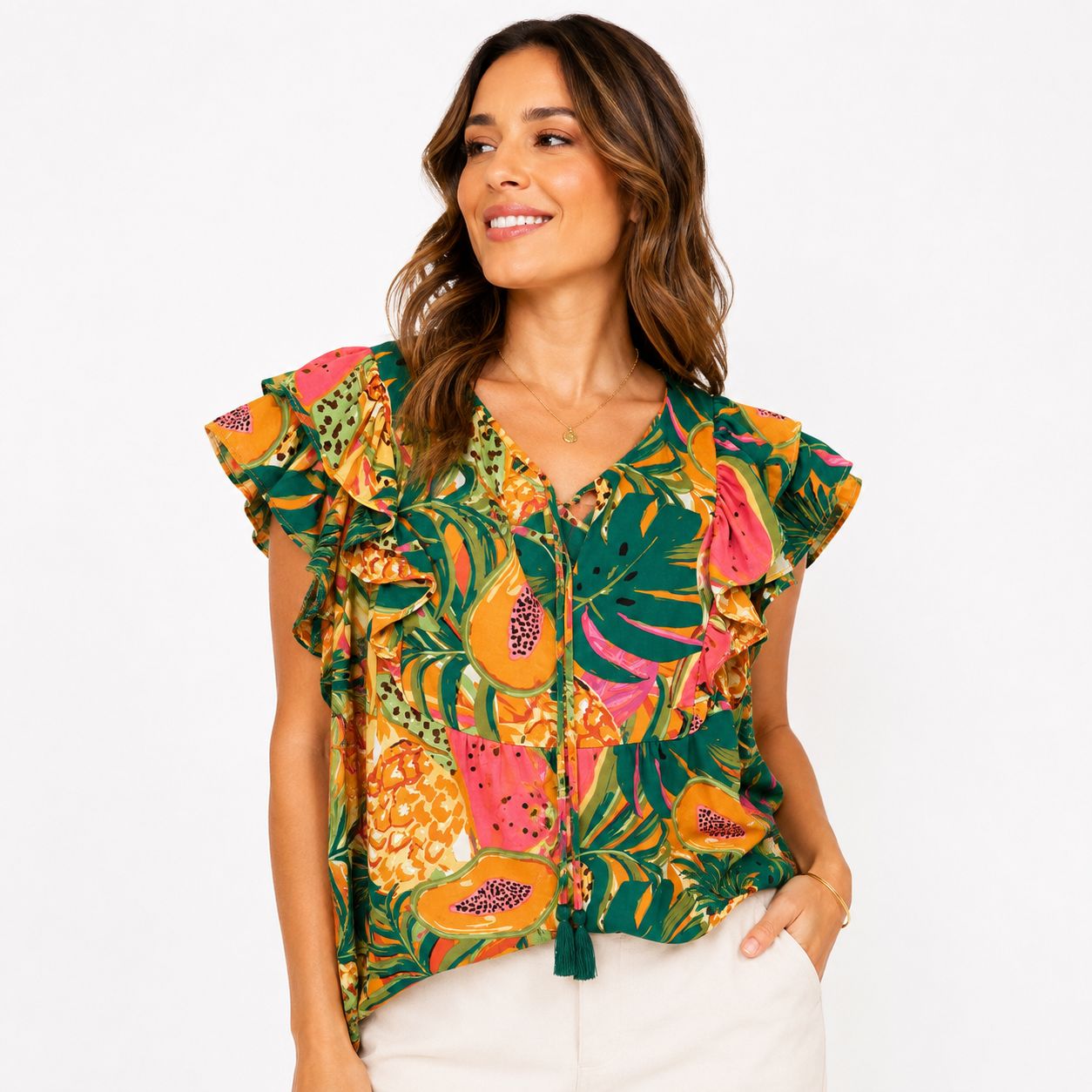 DR2 blouse printed with a colorful tropical design and ruffled sleeves