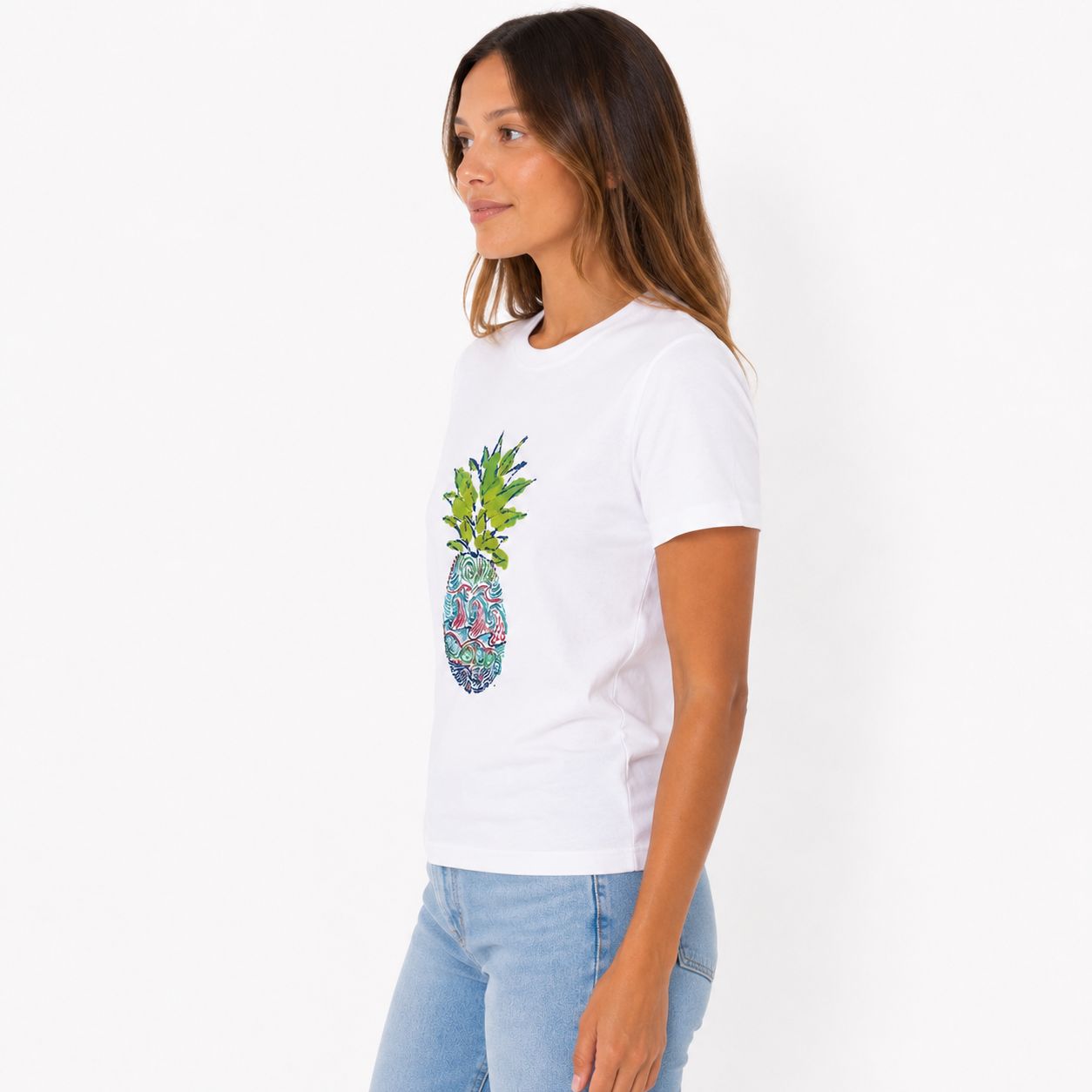 Caribbean Joe's white blouse features a pineapple graphic
